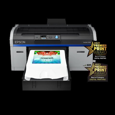 Epson SureColor T-shirt printer with white shirt showing colorful printed design, displaying 2021 and 2022 Premier Print Awards